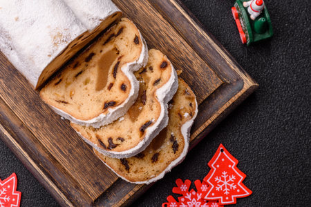 Christmas stollen, a German sweet cake with marzipan fruit and candied fruit. Winter Christmas...