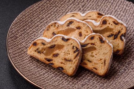Christmas stollen, a German sweet cake with marzipan fruit and candied fruit. Winter Christmas...