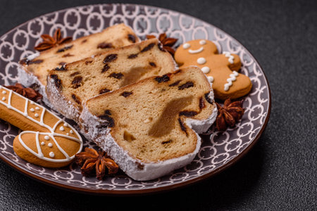 Christmas stollen, a German sweet cake with marzipan fruit and candied fruit. Winter Christmas...
