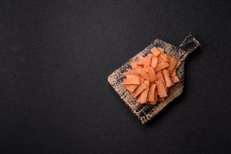 Food, dried squid in shavings or chopped as snacks or jerky. Snack dried squid for beer, background for your designの写真素材