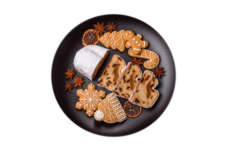 Christmas stollen, a German sweet cake with marzipan fruit and candied fruit. Winter Christmas stollen for the festive tableの写真素材