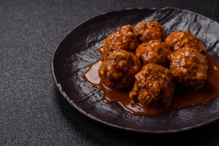 Meat, meatballs in tomato sauce, Italian food, beef or pork with salt and spices. Meatballs with tomatoes as a background for your designの写真素材