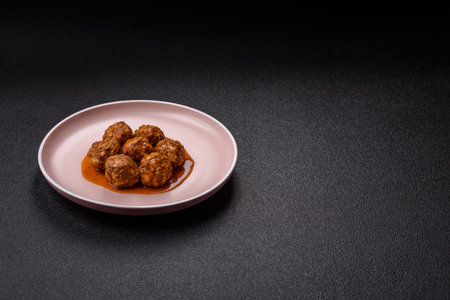 Meat, meatballs in tomato sauce, Italian food, beef or pork with salt and spices. Meatballs with tomatoes as a background for your designの写真素材
