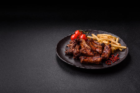Meat, beef ribs in a marinade grilled with salt and spices. Grilled ribs, barbecued meat foodの写真素材