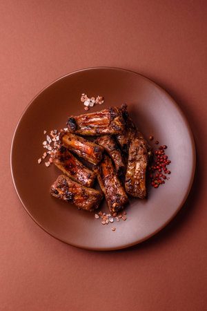 Meat, beef ribs in a marinade grilled with salt and spices. Grilled ribs, barbecued meat foodの写真素材