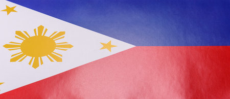 Philippines flag in red, white and blue colors as a symbol of independence. Flag of Philippines as a background for your designの写真素材