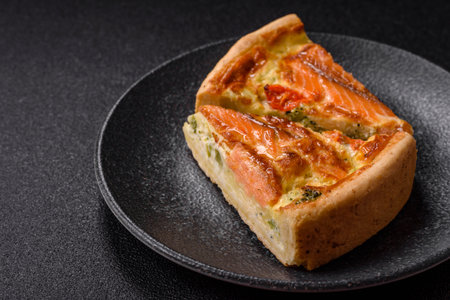 Quiche, salmon pie, broccoli, cheese. Quiche tart with fish and vegetables, cheese, salt and spices, healthy foodの写真素材