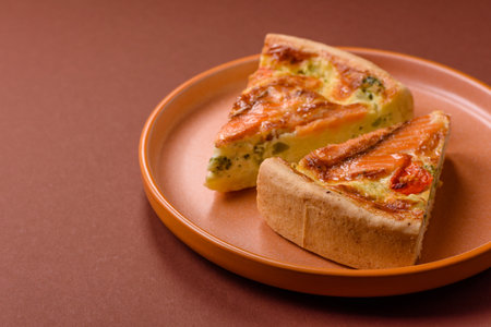 Quiche, salmon pie, broccoli, cheese. Quiche tart with fish and vegetables, cheese, salt and spices, healthy foodの写真素材