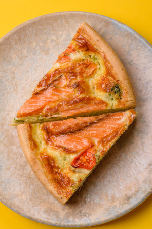 Quiche, salmon pie, broccoli, cheese. Quiche tart with fish and vegetables, cheese, salt and spices, healthy foodの写真素材