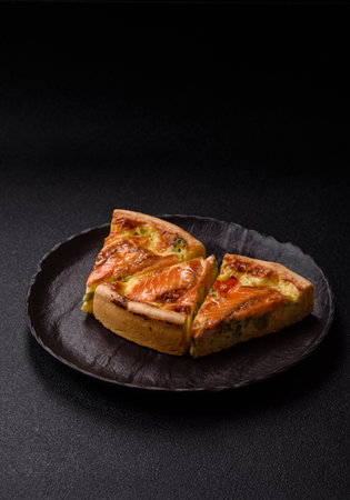 Quiche, salmon pie, broccoli, cheese. Quiche tart with fish and vegetables, cheese, salt and spices, healthy foodの写真素材