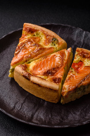 Quiche, salmon pie, broccoli, cheese. Quiche tart with fish and vegetables, cheese, salt and spices, healthy foodの写真素材