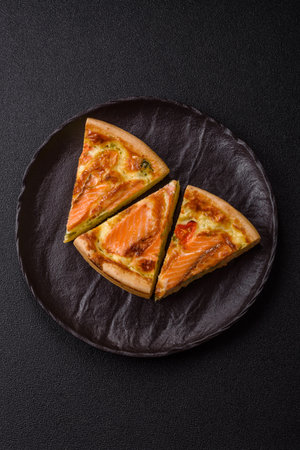Quiche, salmon pie, broccoli, cheese. Quiche tart with fish and vegetables, cheese, salt and spices, healthy foodの写真素材