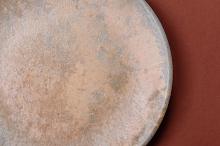 Empty round black plate for food, kitchen utensils on dining table. Empty plate on dark backgroundの写真素材