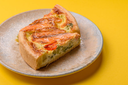 Quiche, salmon pie, broccoli, cheese. Quiche tart with fish and vegetables, cheese, salt and spices,...
