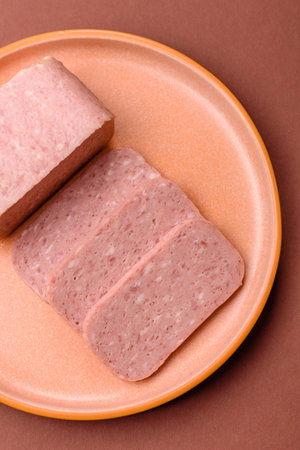 Food, meat, ham sliced in slices for the festive table. Ham with spices, fresh healthy foodの写真素材