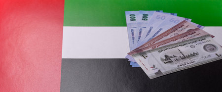 UAE money, dirham, paper banknotes, cash. Emirates money for doing business, travelling