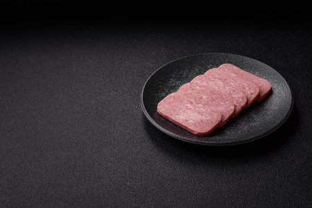 Food, meat, ham sliced in slices for the festive table. Ham with spices, fresh healthy foodの写真素材