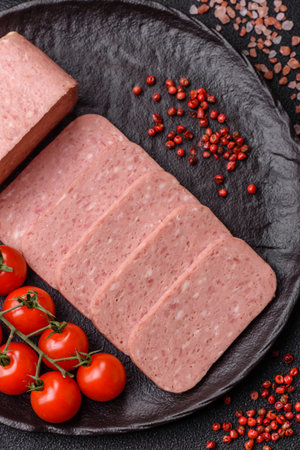 Food, meat, ham sliced in slices for the festive table. Ham with spices, fresh healthy food