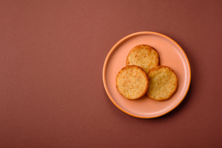 Hash browns, a breakfast food made of potatoes, onions and vegetables. Hash browns with potatoes,...