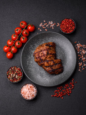 Meat, juicy beef steak grilled cooked to perfection for lunch. Barbecue steak, meat for a hearty mealの写真素材