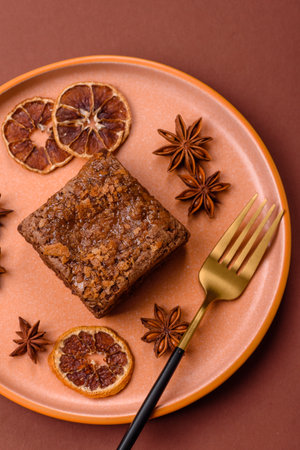 Chocolate brownie cake, food, sweet dessert with nuts rectangular shape. A slice of sweet chocolate brownie for the dinner tableの写真素材