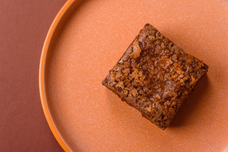 Chocolate brownie cake, food, sweet dessert with nuts rectangular shape. A slice of sweet chocolate brownie for the dinner tableの写真素材