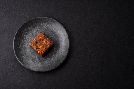 Chocolate brownie cake, food, sweet dessert with nuts rectangular shape. A slice of sweet chocolate brownie for the dinner tableの写真素材