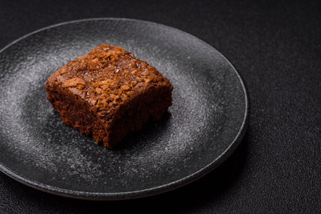 Chocolate brownie cake, food, sweet dessert with nuts rectangular shape. A slice of sweet chocolate brownie for the dinner tableの写真素材