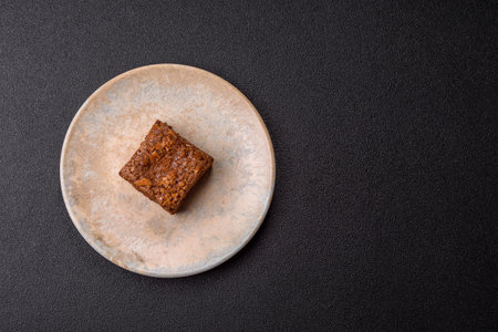 Chocolate brownie cake, food, sweet dessert with nuts rectangular shape. A slice of sweet chocolate brownie for the dinner tableの写真素材