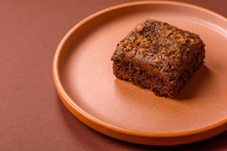 Chocolate brownie cake, food, sweet dessert with nuts rectangular shape. A slice of sweet chocolate brownie for the dinner tableの写真素材