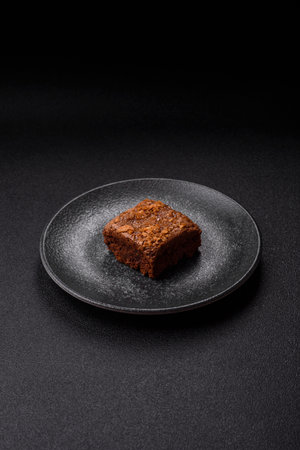 Chocolate brownie cake, food, sweet dessert with nuts rectangular shape. A slice of sweet chocolate brownie for the dinner tableの写真素材