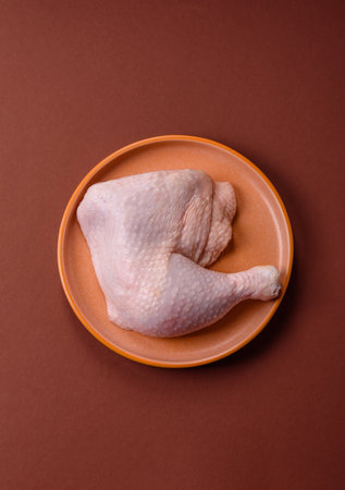 Chicken raw leg or quarter, fresh meat for cooking on barbecue. Chicken quarter for baking at homeの写真素材
