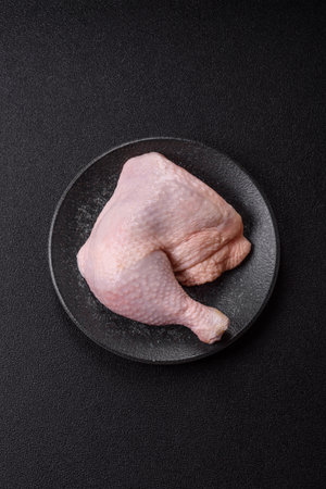 Chicken raw leg or quarter, fresh meat for cooking on barbecue. Chicken quarter for baking at homeの写真素材