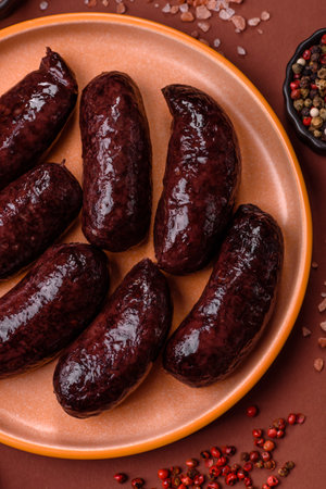 Blood sausage, pudding, meat food with lard and spices. Blood sausage cooked on the grill for dinner