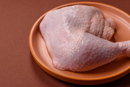 Chicken raw leg or quarter, fresh meat for cooking on barbecue. Chicken quarter for baking at homeの写真素材
