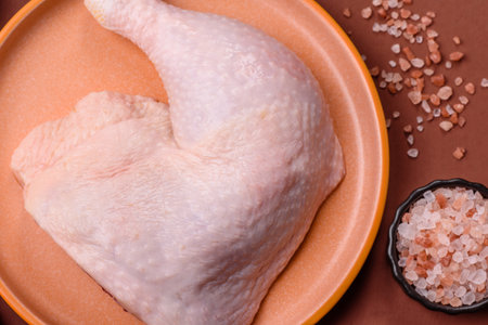 Chicken raw leg or quarter, fresh meat for cooking on barbecue. Chicken quarter for baking at homeの写真素材