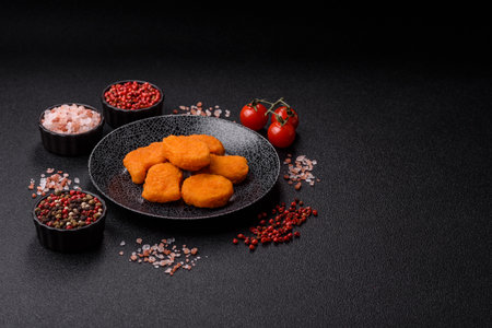 Crispy chicken nuggets, meat takeaway meal with salt and spices. Chicken nuggets, fast food, junk foodの写真素材