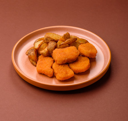 Crispy chicken nuggets, meat takeaway meal with salt and spices. Chicken nuggets, fast food, junk foodの写真素材