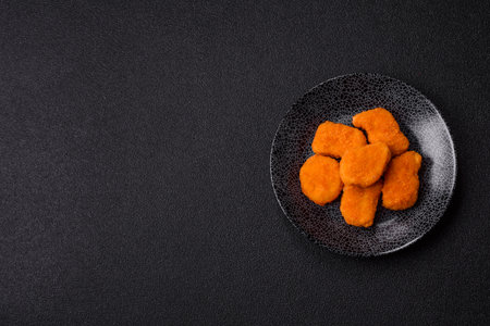Crispy chicken nuggets, meat takeaway meal with salt and spices. Chicken nuggets, fast food, junk foodの写真素材