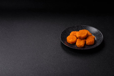 Crispy chicken nuggets, meat takeaway meal with salt and spices. Chicken nuggets, fast food, junk foodの写真素材