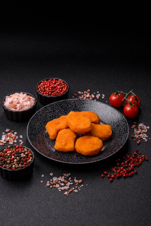 Crispy chicken nuggets, meat takeaway meal with salt and spices. Chicken nuggets, fast food, junk foodの写真素材