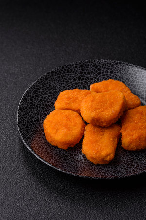 Crispy chicken nuggets, meat takeaway meal with salt and spices. Chicken nuggets, fast food, junk foodの写真素材