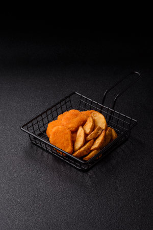 Crispy chicken nuggets, meat takeaway meal with salt and spices. Chicken nuggets, fast food, junk foodの写真素材
