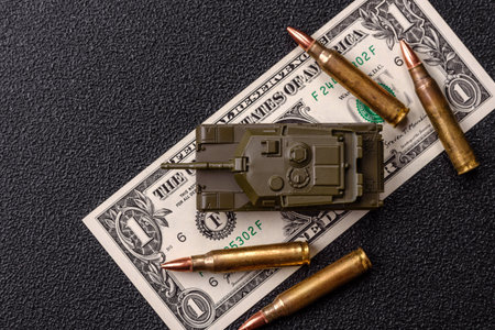 Money, cash dollars to fund weapons for war and defense against attack. Dollars for war as a...