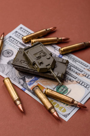 Money, cash dollars to fund weapons for war and defense against attack. Dollars for war as a...
