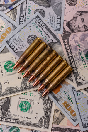 Money, cash dollars to fund weapons for war and defense against attack. Dollars for war as a...