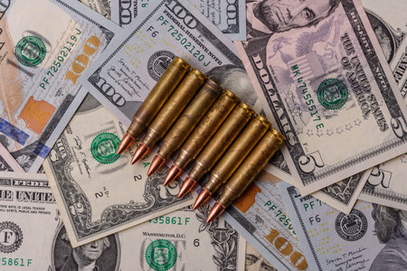 Money, cash dollars to fund weapons for war and defense against attack. Dollars for war as a...
