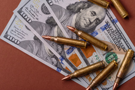 Money, cash dollars to fund weapons for war and defense against attack. Dollars for war as a...