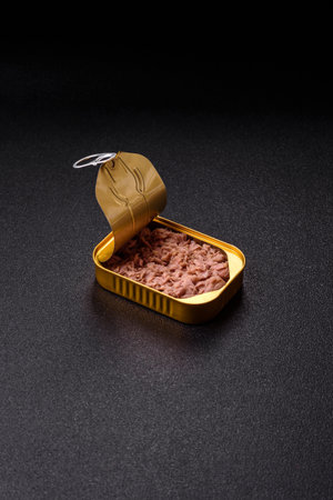 Tuna, canned fish in a can and on a plate for making sandwiches and other food. Canned tuna as an...