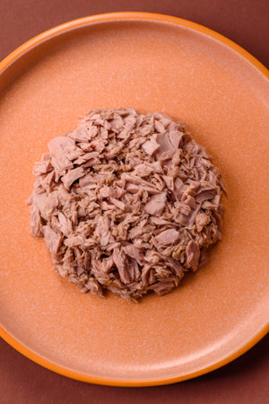Tuna, canned fish in a can and on a plate for making sandwiches and other food. Canned tuna as an...